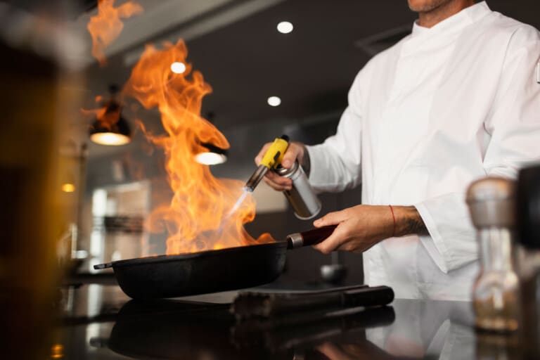 side view man cooking job