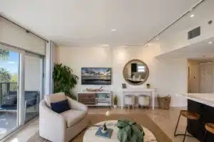 Modern Miami vacation home rental living room with waterfront view and coastal luxury decor