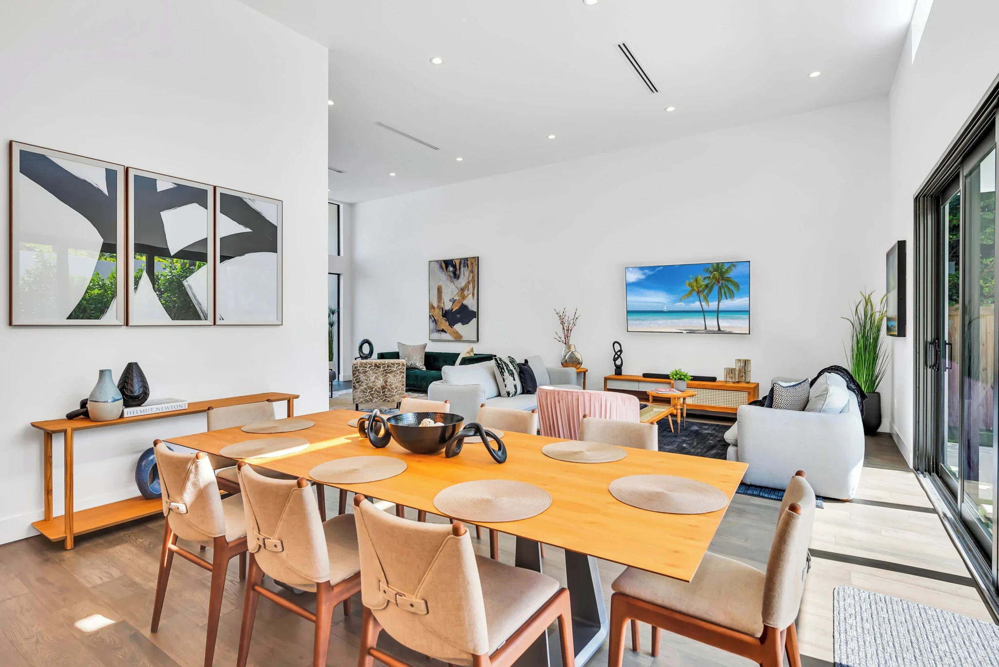 Modern dining area with wooden table in Miami vacation rental home for families