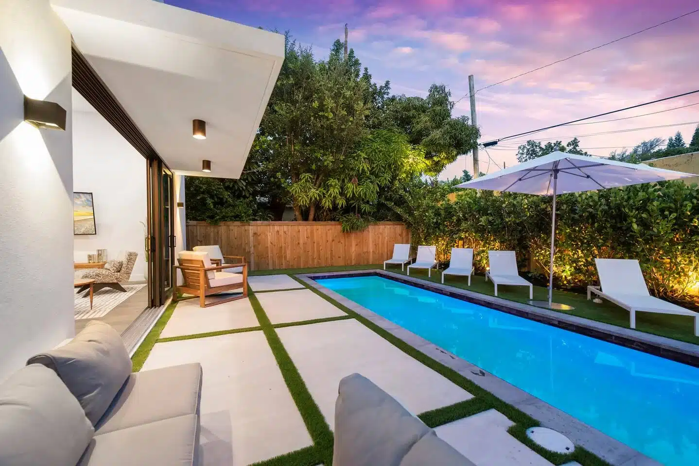 Backyard pool and lounge chairs at a Miami rental, where to stay on Miami Beach for groups