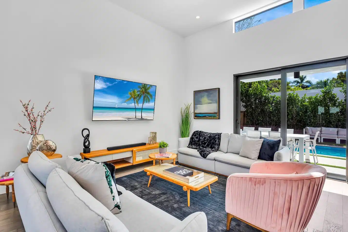 Modern living room with pool view, a relaxing base after Miami attractions